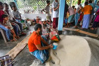 | Photo: PTI : Food items being distributed in Assam